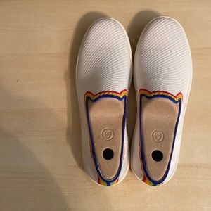 Rothy’s never worn rainbow slip-on sneakers.  Size 10